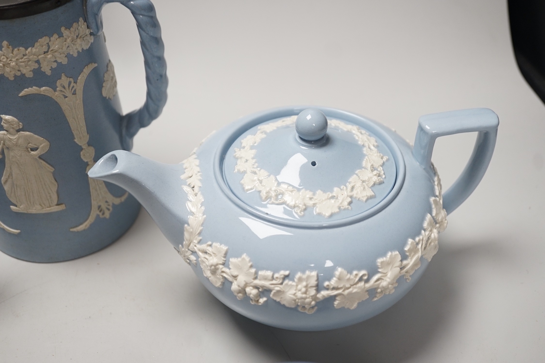 A group of Wedgwood and Wedgwood-style jasperware teapots and jugs.